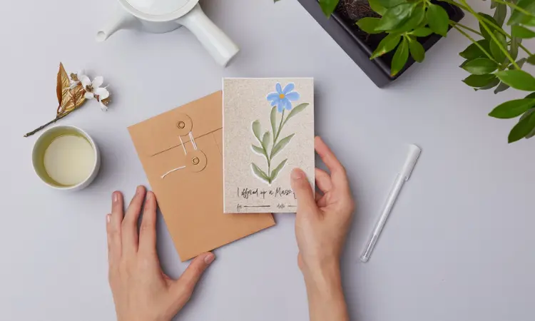 Hand holding a spiritual bouquet card