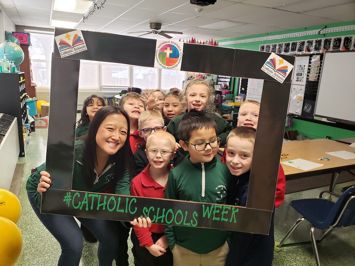 Teacher and students smiling