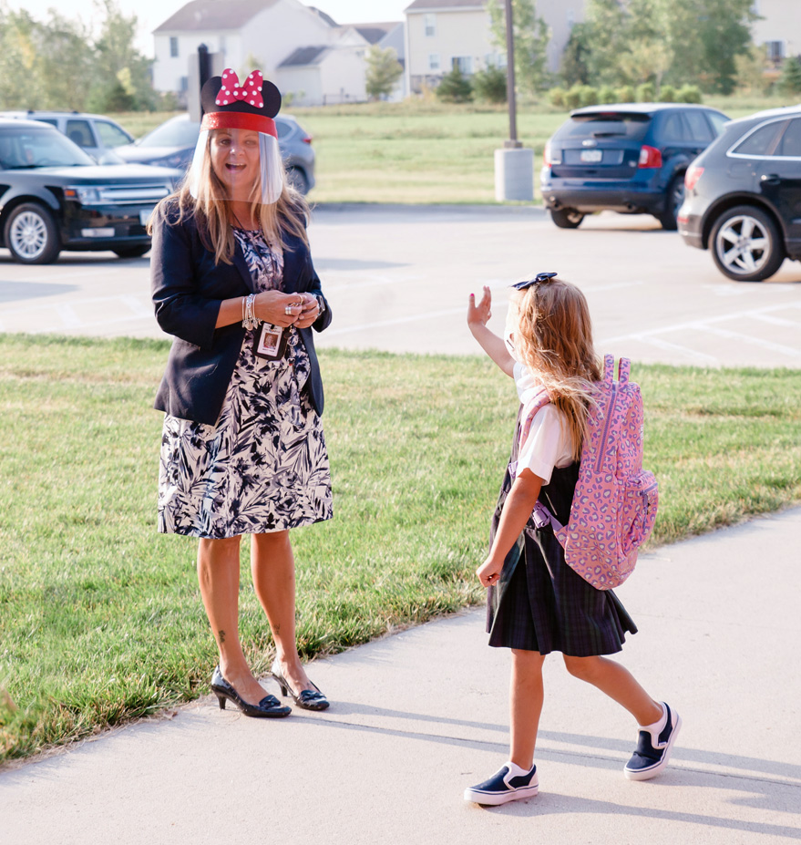 Student waves to principal on first day of school