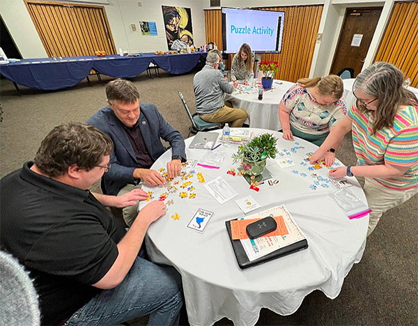 School administrators doing a puzzle activity