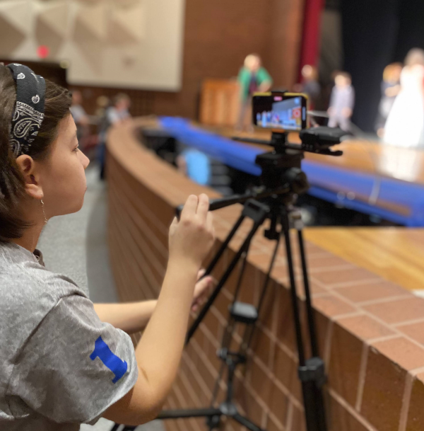 Student works a video camera