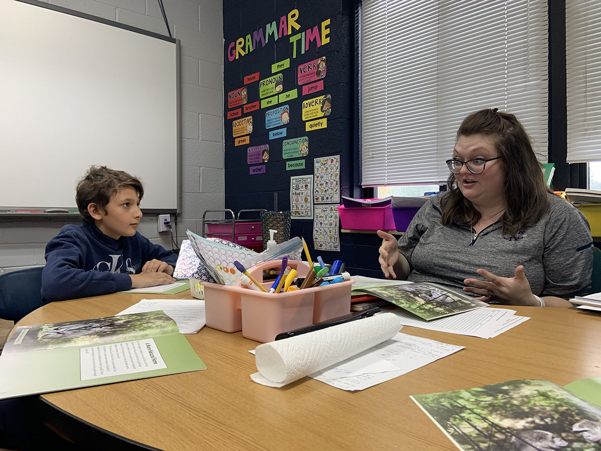 Teacher talks to student