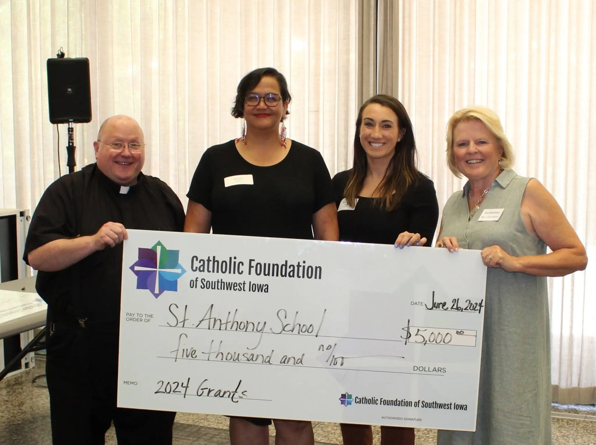 Teachers from St. Anthony accepting grant from CFSWIA Teachers from St. Anthony accepting grant from CFSWIA