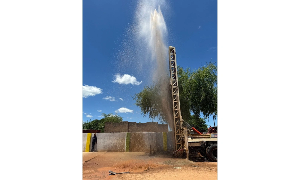 Water spraying in the air after Blessman International drilled a well Water spraying in the air after Blessman International drilled a well