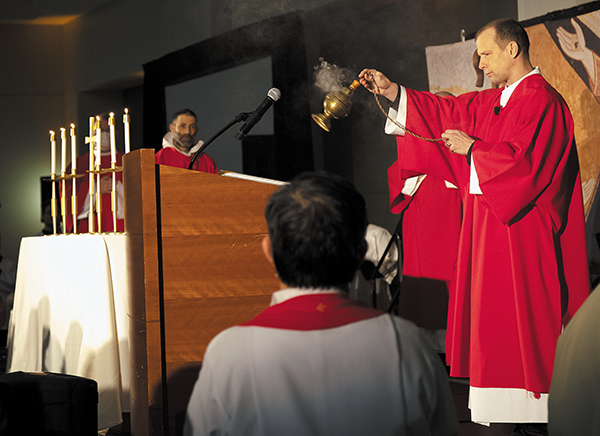 Deacon Mark Campbell uses incense