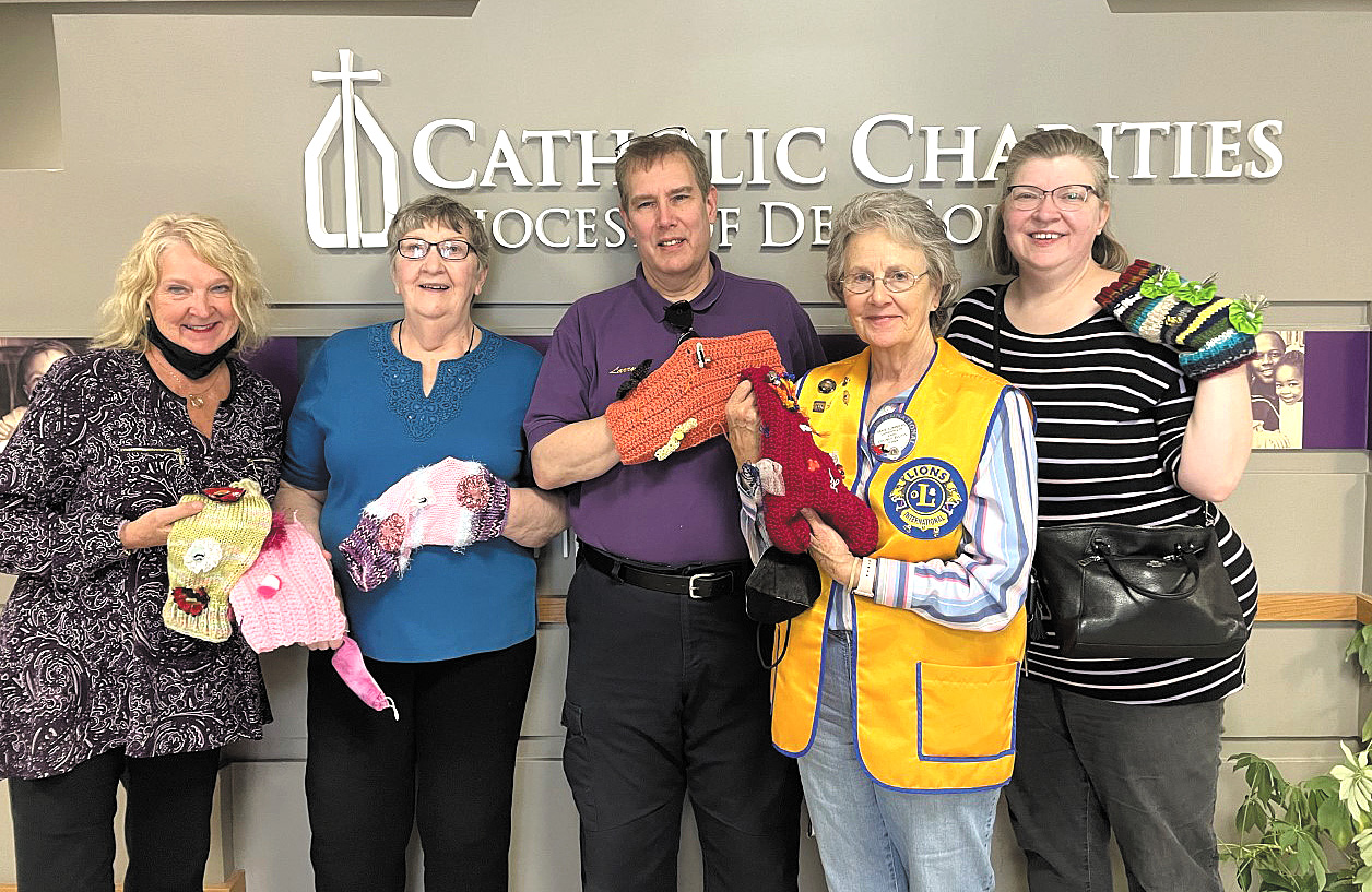 Catholic Charities staff show twiddle muffs