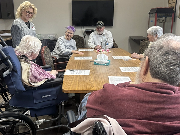 Parishioners and the activities director enjoy a moment