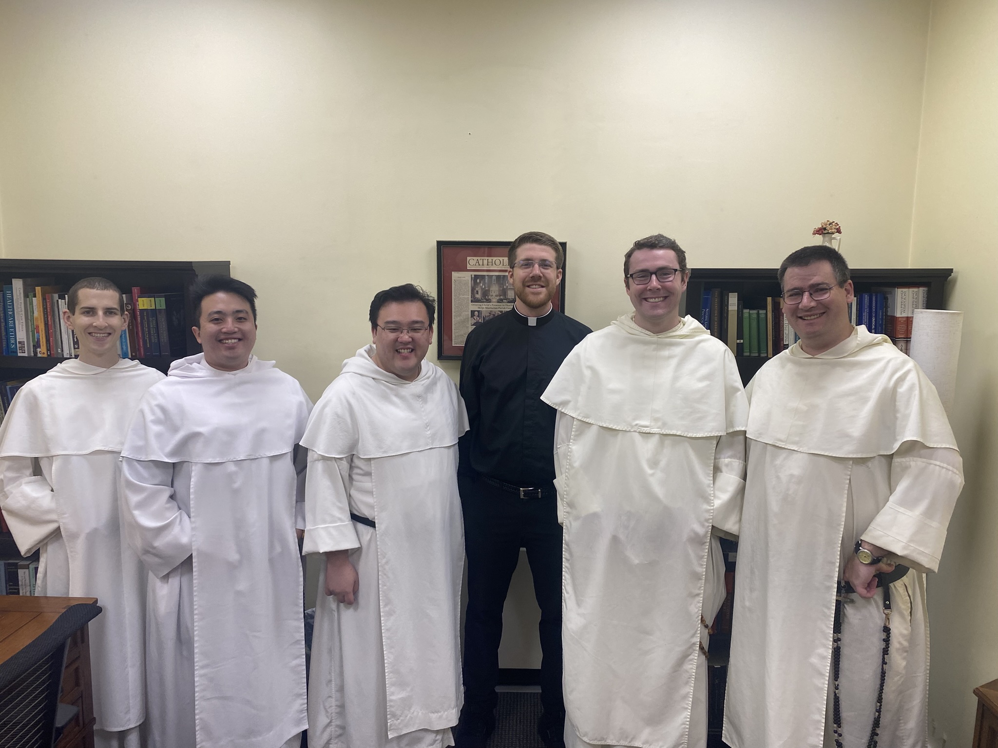 Matthew Johll stands with fellow seminarians at  Memorial Sloan Kettering Cancer Center in Manhattan.