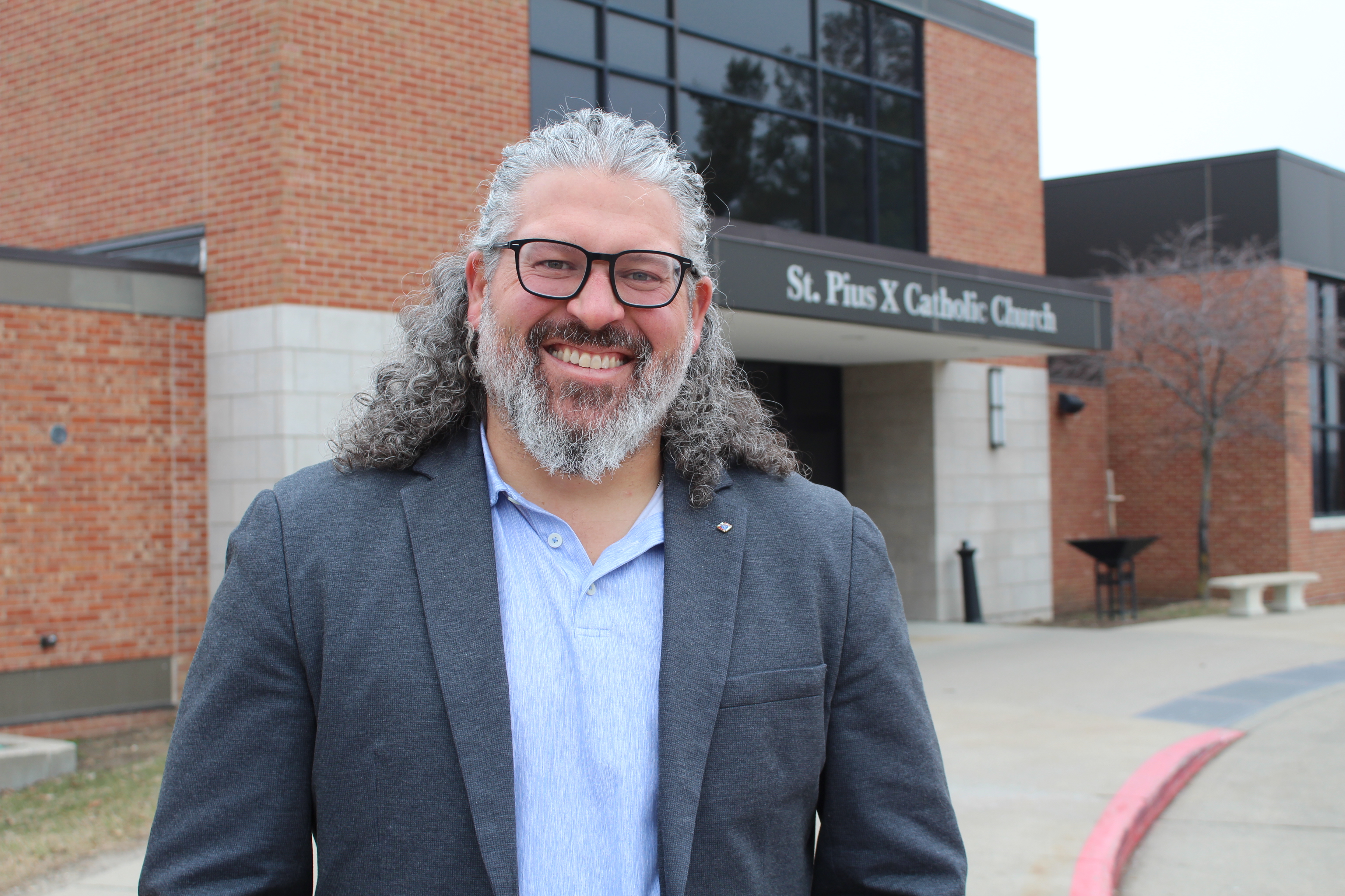 AJ Brown stands outside his parish, St. Pious X. 