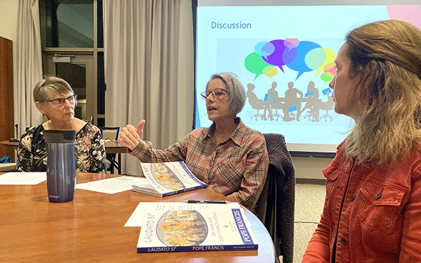 Rita Bresnan participates in a small group discussion about caring for creation.