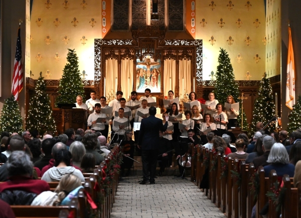 Dr. Marion Scott leads a choir at St. Augustin's Cathol