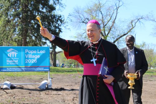 Bishop Joensen blesses the Pope Leo Village groundbreak