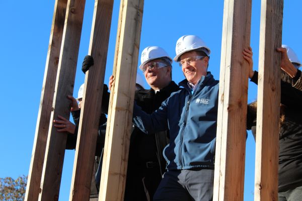 Bishop William Joensen stands with Des Moines Mayor Connie Boesen at the Pope Leo Village ceremony. 