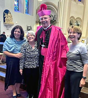 Bishop with organizers of the Hispanic lay ministry class