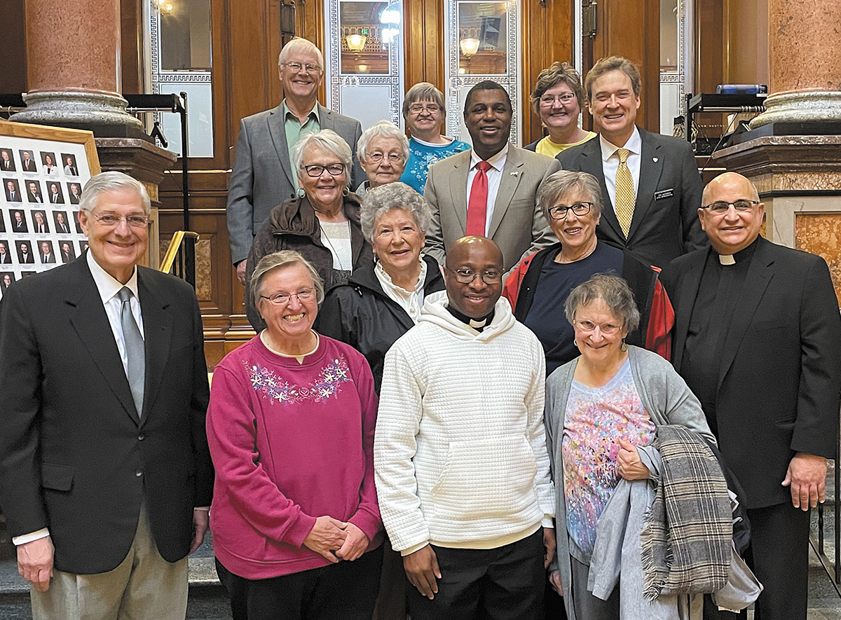 Father Raphael Assamah and supporters