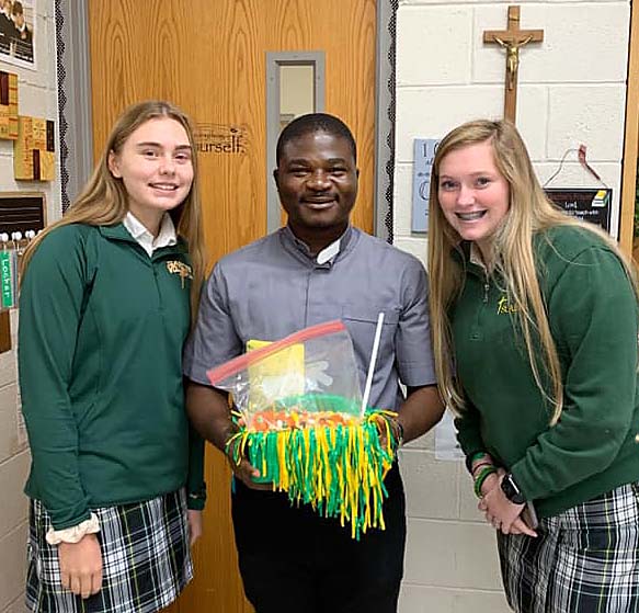 Father Augustine Clement Owusu with students