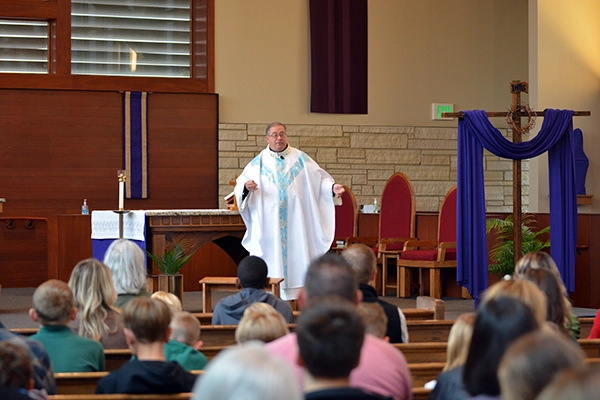 Father Ken Halbur preaches at Saint Luke the Evangelist