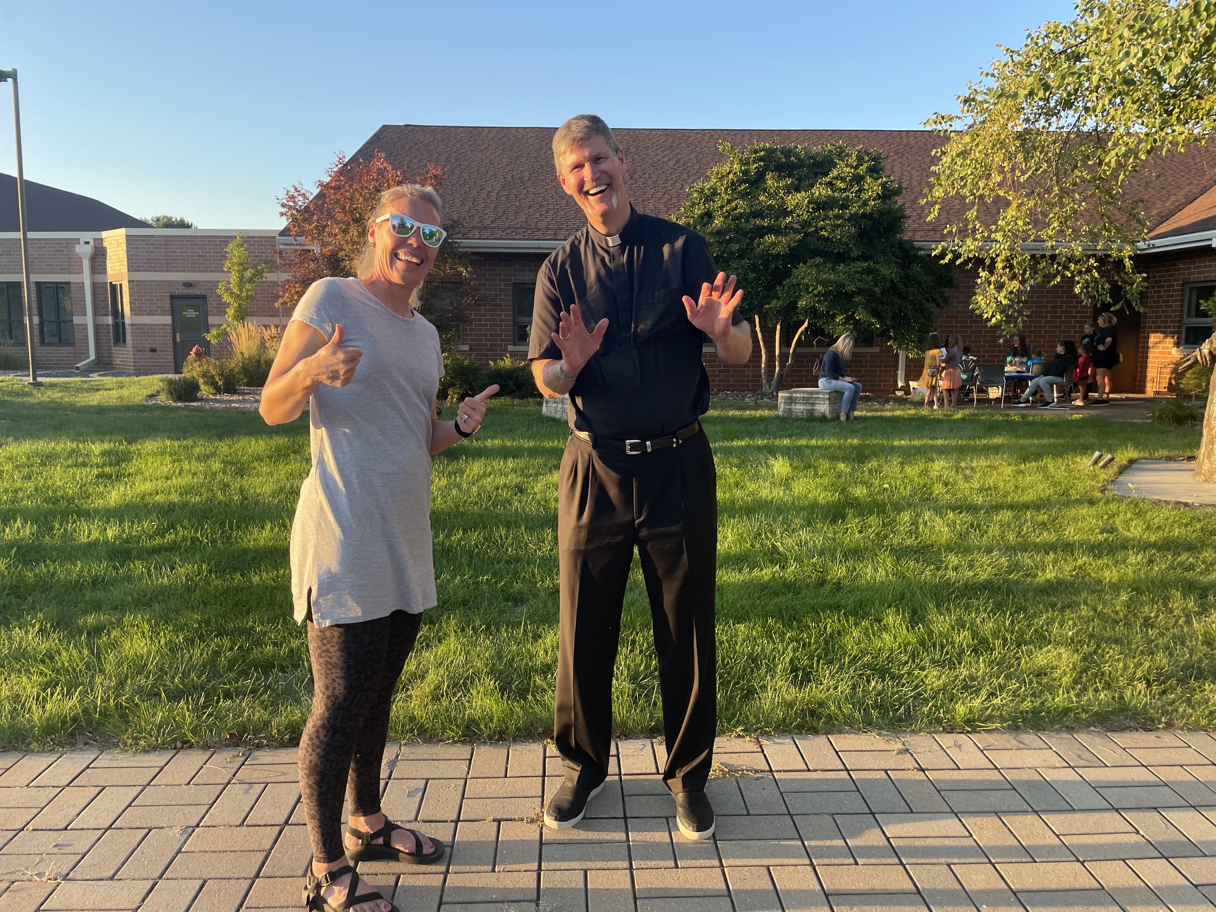 Father Mark McGeary and Christy Bartels