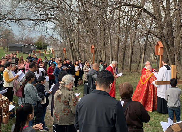 Christ the King community members pray at outdoor Stati