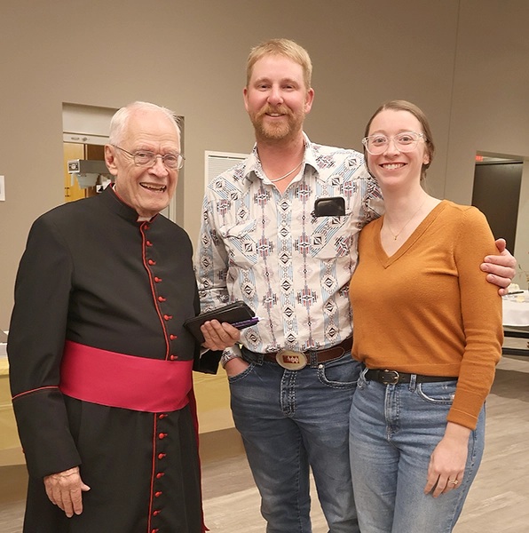 Monsignor Lawrence Beeson with parishioners of Saints Peter and Paul Parish in Atlantic.