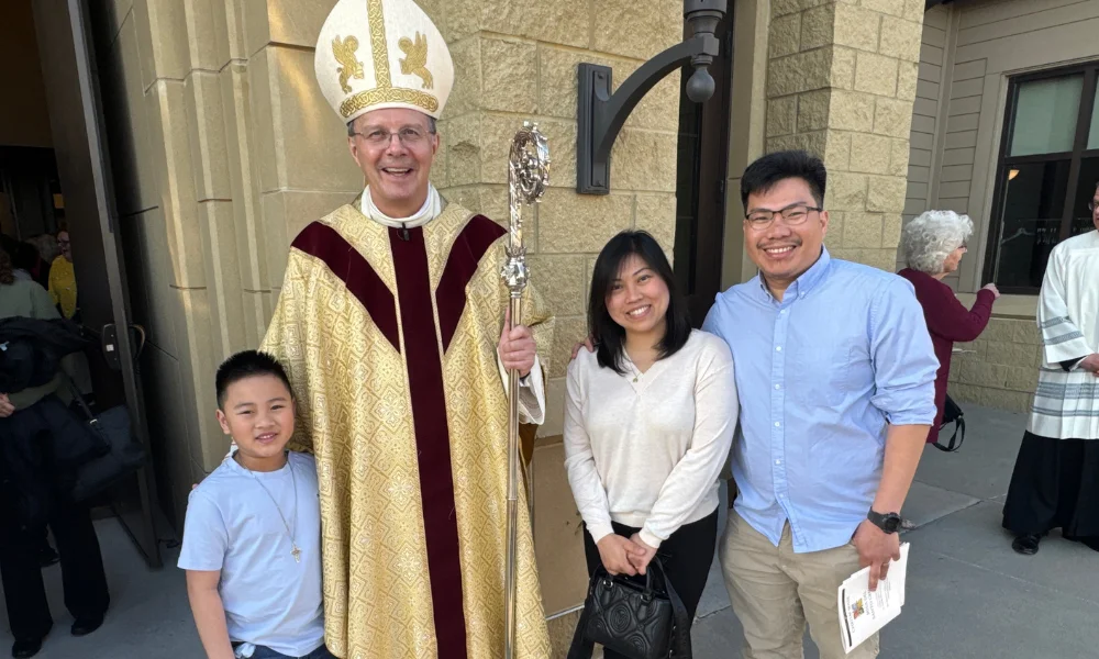 The Banaag family with Bishop William Joensen in Counci