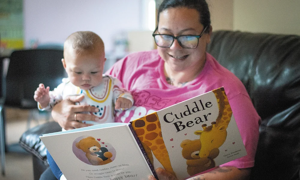 A family reads together at the Emergency Family Shelter