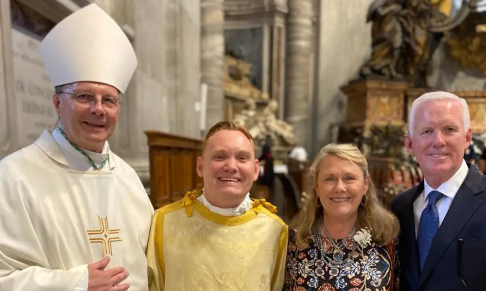 Deacon Mike Mahoney with his parents and Bishop Joensen