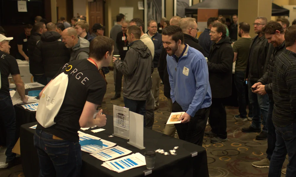 Two men talking at the 2025 FORGE Men's Conference
