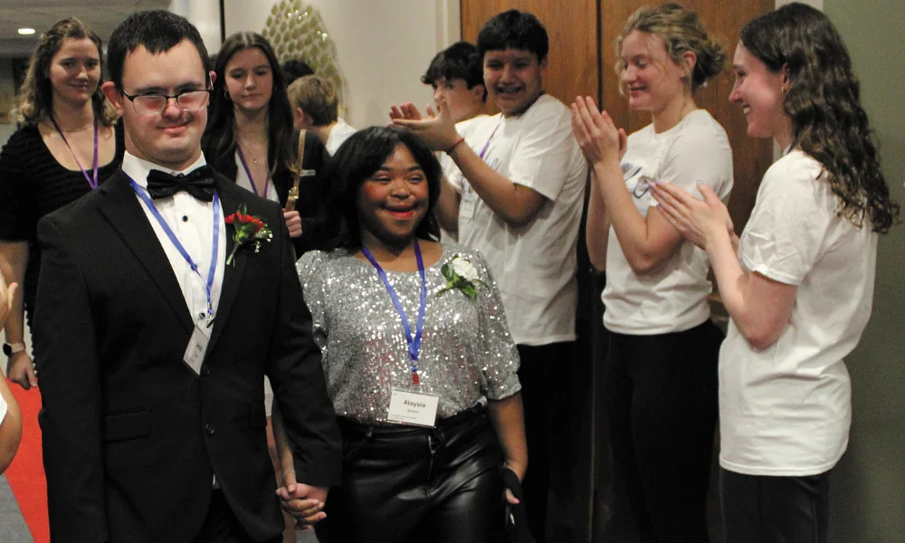 Walking the red carpet at Night to Shine at Sacred Hear
