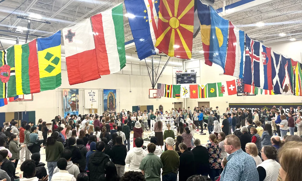 Teens praying an international rosary at YOUTH 2000