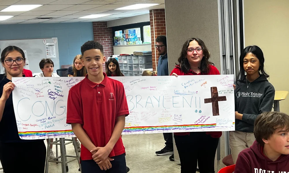 Students at Holy Trinity show support for their classmate, Braylen, as he goes through OCIA. Students at Holy Trinity show support for their classmate, Braylen, as he goes through OCIA.