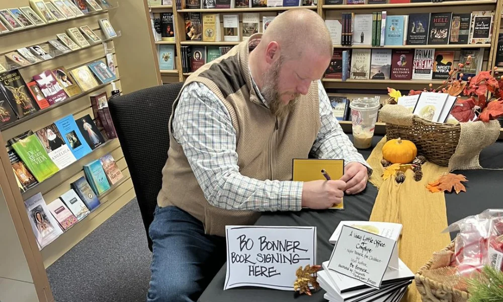 Bo Bonner signing books at Divine Treasures in Des Moin