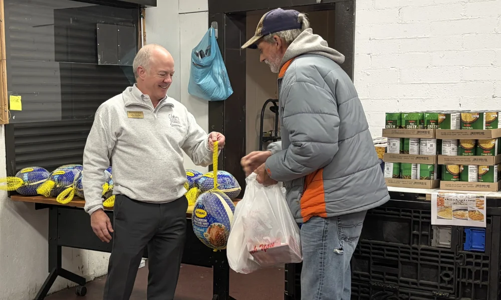 Mike Sheehy handing out turkeys
