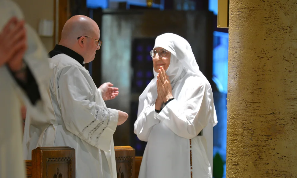 Victoria Carver with Fr. PJ McManus at her consecration