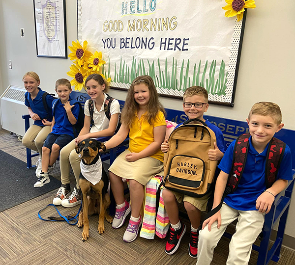 Dougie the dog with students Dougie the dog with students