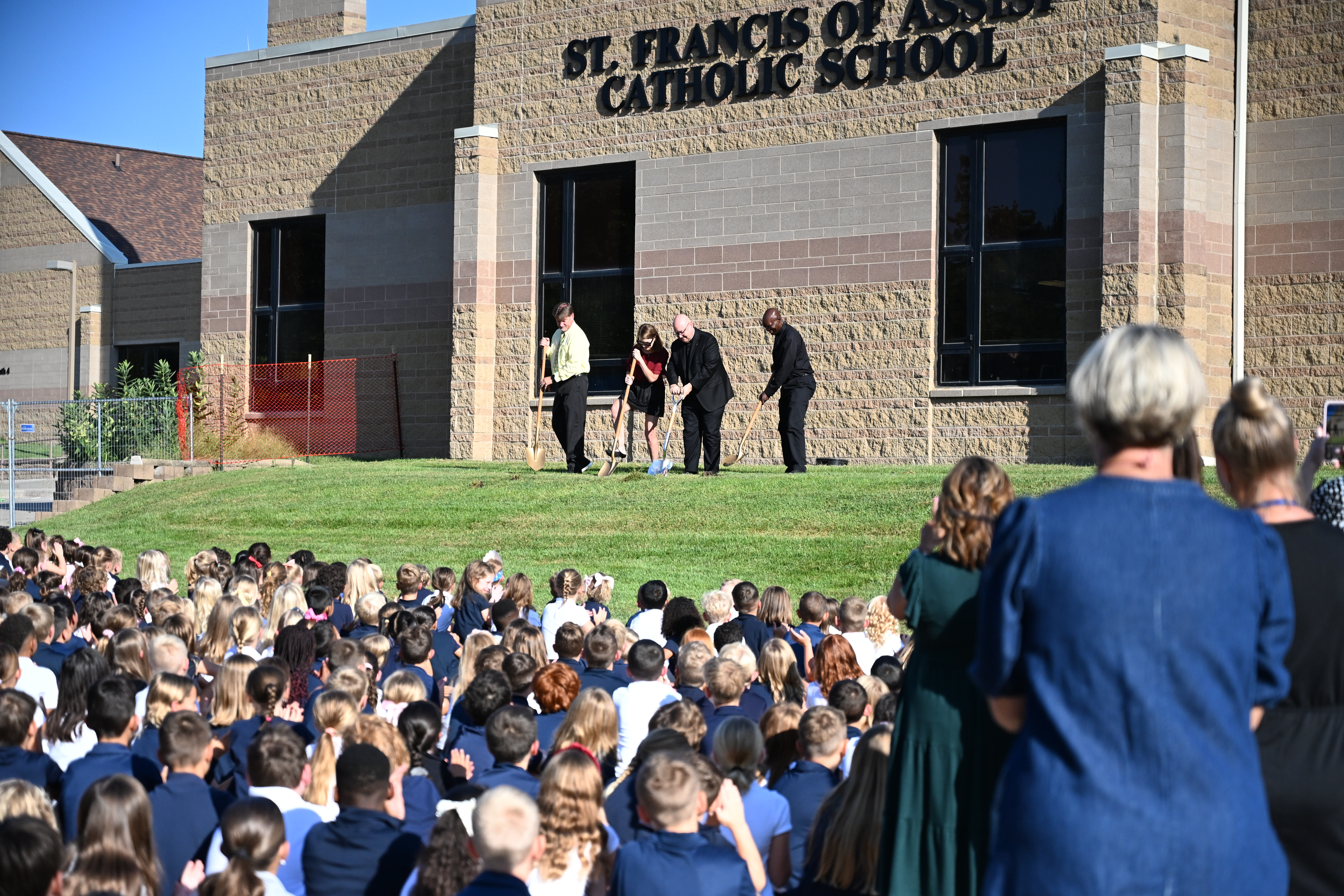 St. Francis of Assisi students watch as school and parish leaders break ground on a preschool construction project on August 28, 2026.