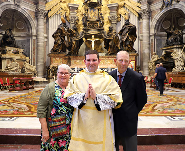 Deacon Alex Kramer and his parents