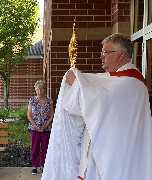 Father Dan Kirby with the monstrance