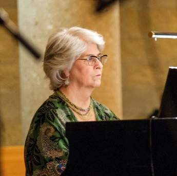 Janet Bradford plays the piano at St. Francis of Assisi Parish in West Des Moines
