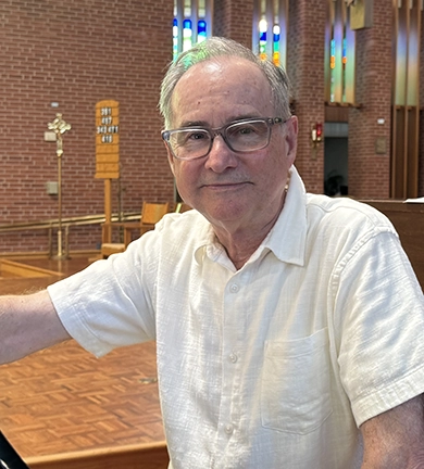 Tom Quiner leads music at Holy Trinity Parish in Des Moines.