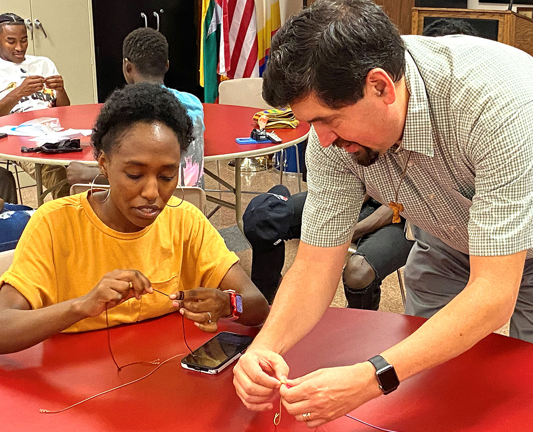 Antonio Banuelos shows a World Youth Day pilgrim how to